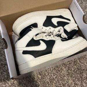 Woman’s White and Black Sneakers